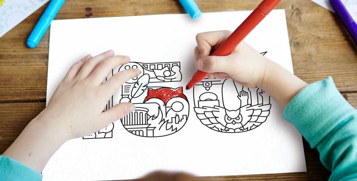 A child coloring in the anniversary illustration.