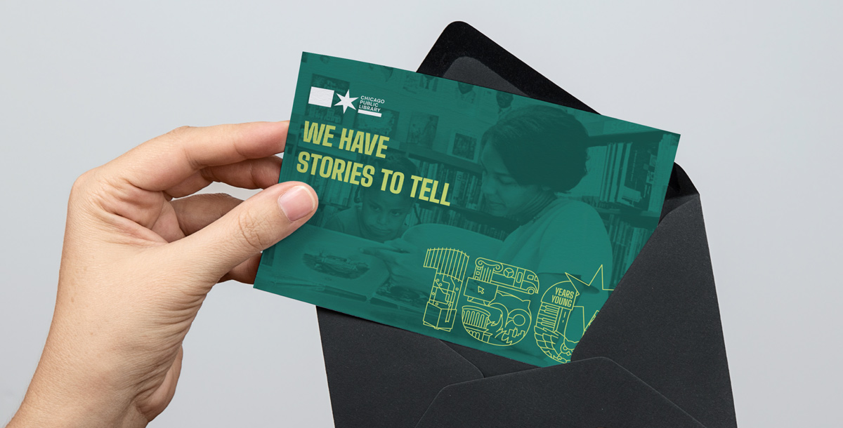 Print postcard with the 150th logo being pulled out of an envelope.